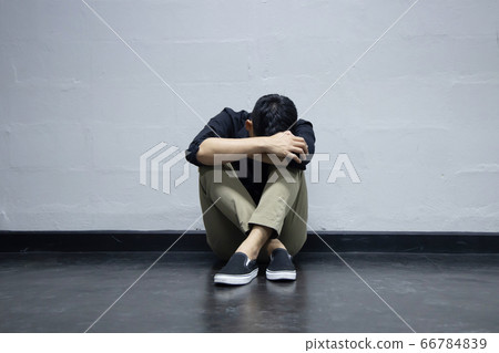 The Depression Businessman Sitting Near the Wall on the Floor The Depression Businessman Sitting Near the Wall on the Floor 66784839