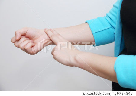 isolated woman measure her heart rate 66784843