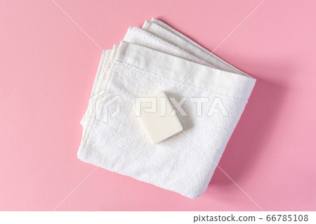 Towel with soap on a pink background 66785108
