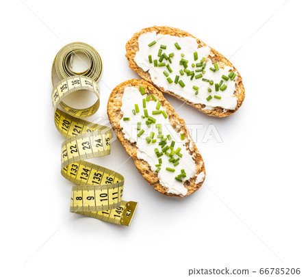 Crispbread with creamy cheese. Crispbread with creamy cheese. 66785206