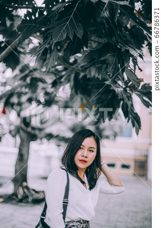 Young Asian beautiful businesswoman walking on street hurry to work. 66786371
