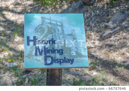 Historic Mining Display Sign for old Gold Mining Equipment. Prescott Valley, Yavapai County, Prescott National Forest, Arizona USA Historic Mining Display Sign for old Gold Mining Equipment. Prescott Valley, Yavapai County, Prescott National Forest, Arizona USA 66787646