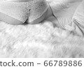 Beautiful female ass in white underwear on a soft bed in monochrome 66789886