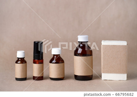 Set of cosmetic dark amber glass bottles with 66795682