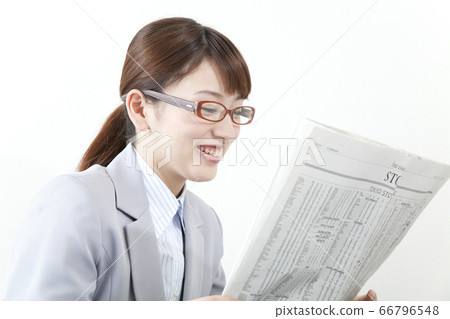 Reading alphabetical newspaper Business woman Reading alphabetical newspaper Business woman 66796548