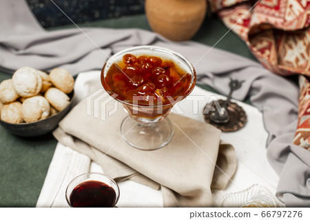 Confiture and butter cookies on the white tablecloth Confiture and butter cookies on the white tablecloth 66797276