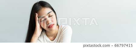 Banner Asian are holding their heads because of headaches. She has a fever and migraine because of stress or sleep late, low sleep, insufficient rest in healthy concept with copy space Banner Asian are holding their heads because of headaches. She has a fever and migraine because of stress or sleep late, low sleep, insufficient rest in healthy concept with copy space 66797415