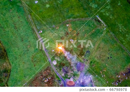 Aerial view of fire to get rid of waste on a peat bog 66798978