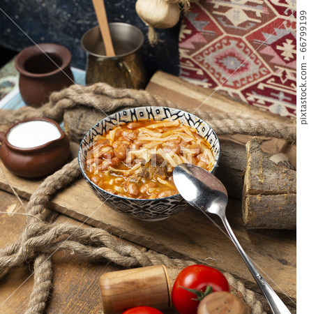 Traditional caucasian beans with rice and pasta in tomato sauce 66799199