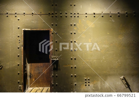 Dark metal wall and door in a bunker 66799521
