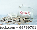 Money jar with covid19 label 66799701