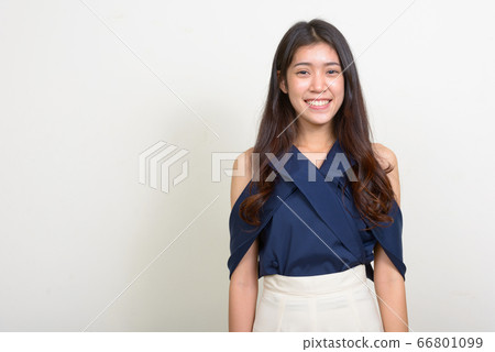 Portrait of happy young beautiful Asian businesswoman smiling Portrait of happy young beautiful Asian businesswoman smiling 66801099