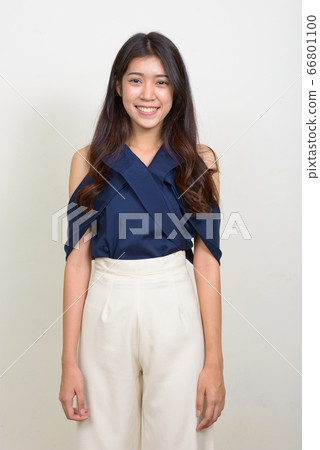 Portrait of happy young beautiful Asian businesswoman smiling Portrait of happy young beautiful Asian businesswoman smiling 66801100