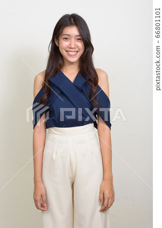Portrait of happy young beautiful Asian businesswoman smiling Portrait of happy young beautiful Asian businesswoman smiling 66801101