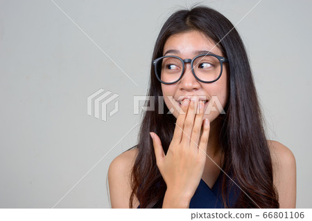 Face of young beautiful Asian businesswoman looking guilty Face of young beautiful Asian businesswoman looking guilty 66801106