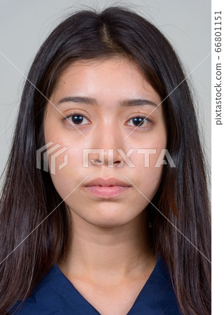 Face of young beautiful Asian businesswoman looking at camera Face of young beautiful Asian businesswoman looking at camera 66801151