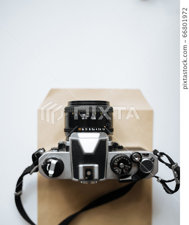 Vintage film camera on a white background 66801972