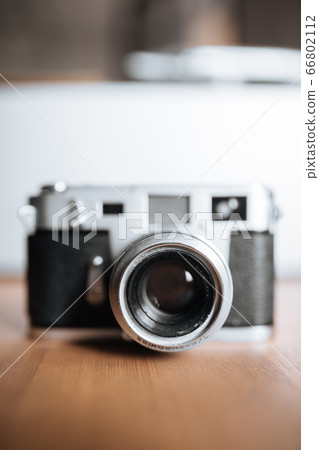 Vintage film camera on a white background 66802112