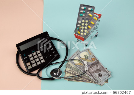 Health care cost concept. Stethoscope and drugs, dollars money banknotes on colorful background 66802467