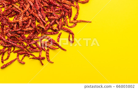 Top view dry red hot Thai chilli yellow paper Top view dry red hot Thai chilli yellow paper 66803802