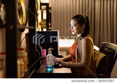 Portrait of young beautiful Indian woman working from home late at night Portrait of young beautiful Indian woman working from home late at night 66805897