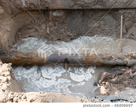 close-up of ruptured sewer rusty pipeline which 66806697