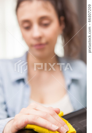 Housewife cleans up dust 66807209