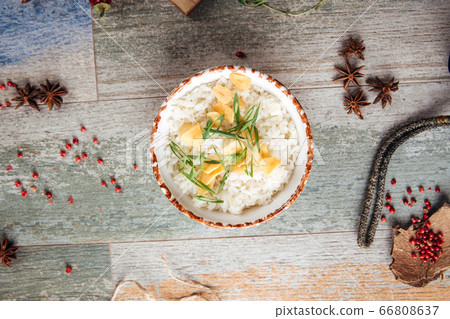 Boiled white rice garnish green onion dried garlic Boiled white rice garnish green onion dried garlic 66808637