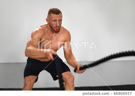 Gym battle rope man stamina training Athlete guy 66808937