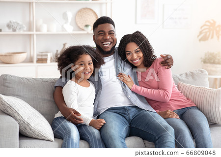 Family lifestyle portrait of happy black mom, dad and daughter at home Family lifestyle portrait of happy black mom, dad and daughter at home 66809048