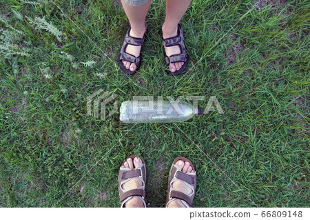 foots and used plastic bottle as garbage on the foots and used plastic bottle as garbage on the 66809148