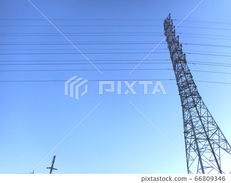 Looking up at a transmission tower Looking up at a transmission tower 66809346
