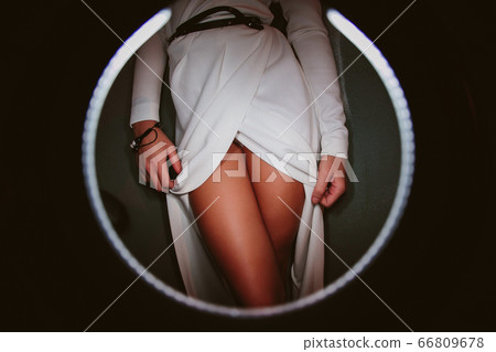 a girl takes off a dress the sexual undresses. 66809678