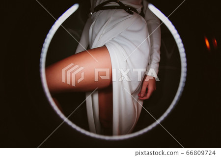 a girl takes off a dress the sexual undresses. 66809724