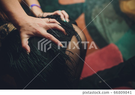 a girl takes off a dress the sexual undresses. 66809841