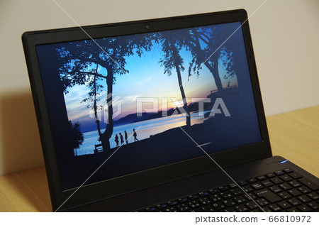 Scenery of a tourist spot (Matsue City, Shimane Prefecture... Evening view of Akika Town) is displayed on a computer screen 66810972