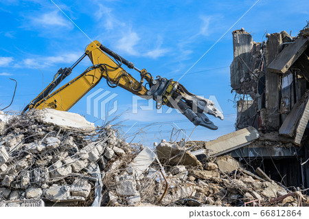 Building House Demolition site Excavator with hydraulic crasher machine and yellow container Building House Demolition site Excavator with hydraulic crasher machine and yellow container 66812864