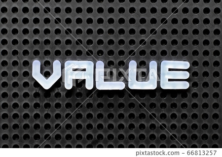 White color alphabet with word value on black pegboard background White color alphabet with word value on black pegboard background 66813257