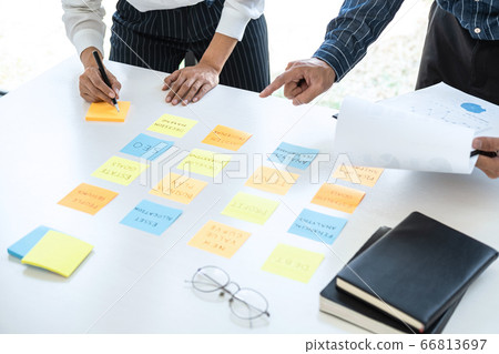 Two creative business people meeting and planning Two creative business people meeting and planning 66813697