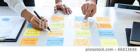 Two creative business people meeting and planning Two creative business people meeting and planning 66813698