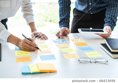 Two creative business people meeting and planning Two creative business people meeting and planning 66813699