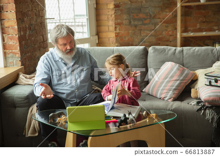 Grandfather and child playing together at home. Happiness, family, relathionship, education concept. Grandfather and child playing together at home. Happiness, family, relathionship, education concept. 66813887