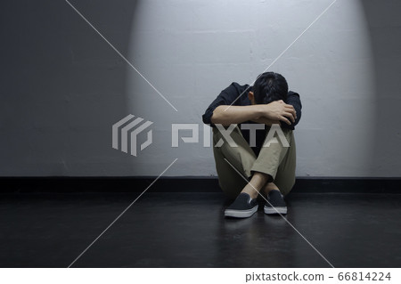 Depression Businessman Sitting Near the Wall on Depression Businessman Sitting Near the Wall on 66814224