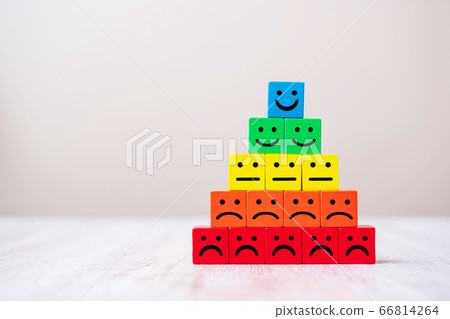 Emotion face symbol on wooden cube blocks. Service Emotion face symbol on wooden cube blocks. Service 66814264