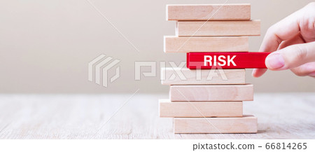 Businessman hand placing or pulling wooden block Businessman hand placing or pulling wooden block 66814265