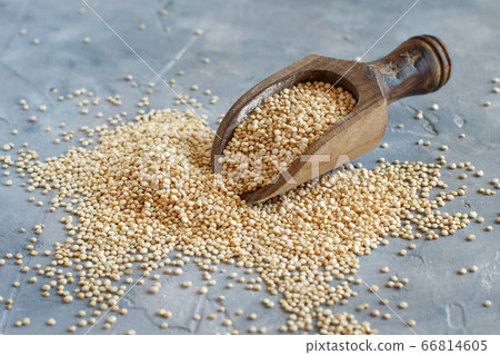 Raw dry white quinoa seeds close up 66814605