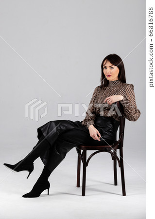 Woman in blouse and culottes on white 66816788