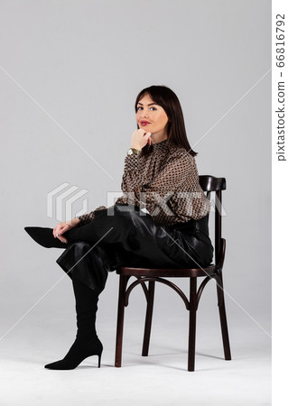 Woman in blouse and culottes on white Woman in blouse and culottes on white 66816792