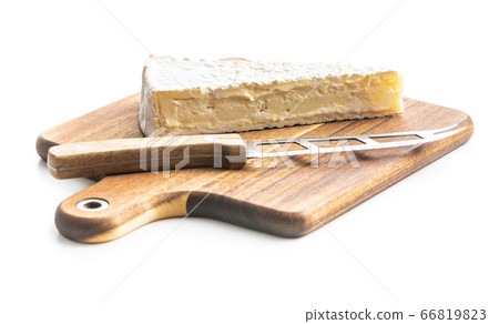 Brie cheese. White soft cheese with white mold on Brie cheese. White soft cheese with white mold on 66819823