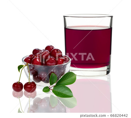 cherry juice in a glass with cherries 66820442